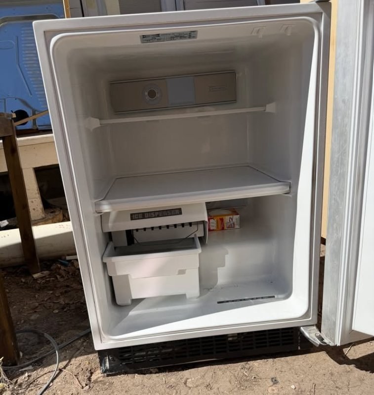 Sub-Zero minifridge with wood door panel